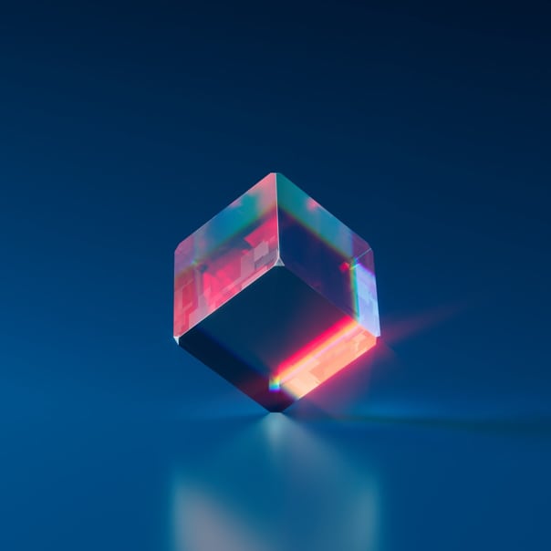 Colorful crystal block balanced on one corner.